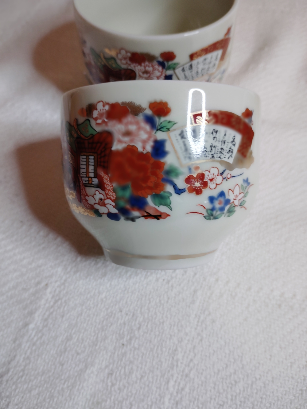 Hand-Painted Porcelain Floral Cup in Red and Blue with Gold Accents